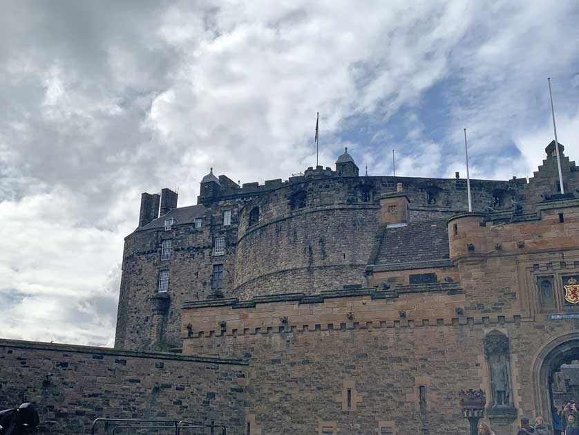 The brooding walls of the castle tower above the city.