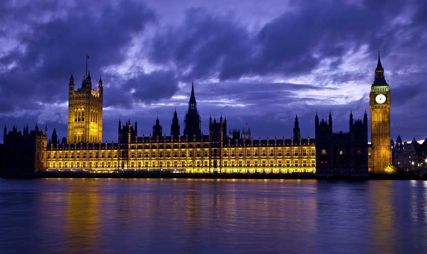 The Palace of Westminster illuminated at night.