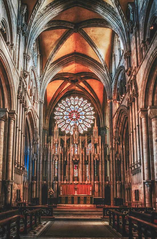 The nave and stained glass in the church.